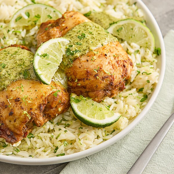 A plate of rice with a lime wedge on top.