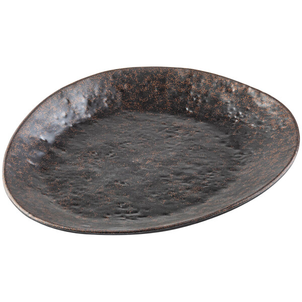 A black melamine plate with a brown rim.