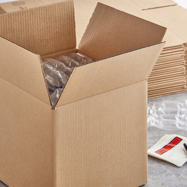 A Lavex corrugated cardboard shipping box with clear plastic bottles inside.