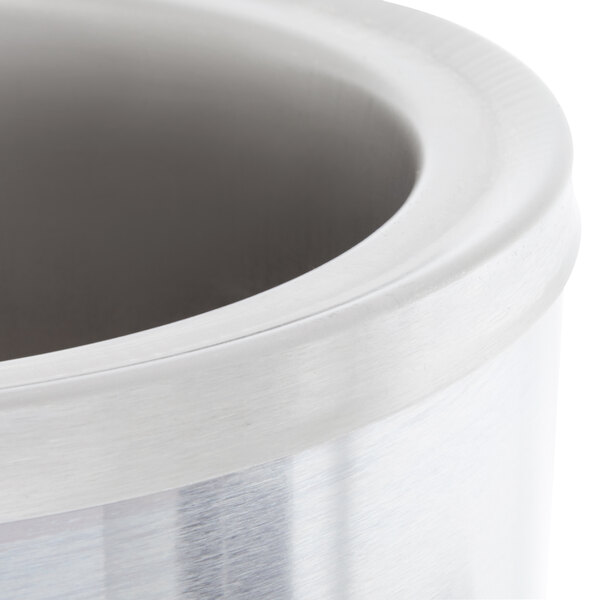 A close up of a silver container with a stainless steel bowl inside.