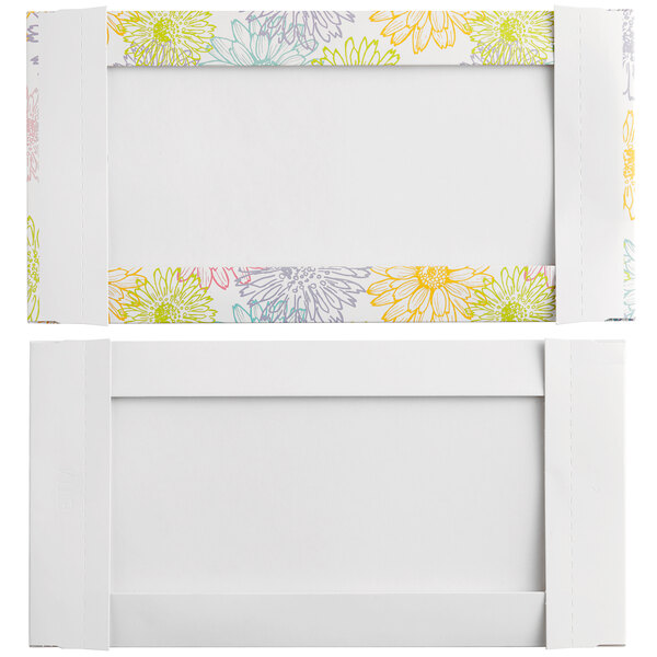 Two white rectangular candy boxes with colorful flowers on them.