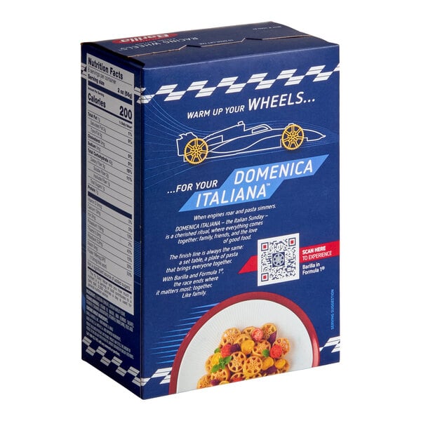 A blue box featuring racing-themed graphics, nutrition facts on the side, a QR code, and an image of wheel-shaped pasta in a bowl at the bottom.