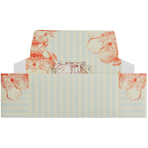 A white vintage candy box with a rabbit print on it.