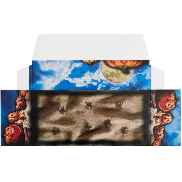 A white candy box with a Jack-O'-Lantern and moon print.