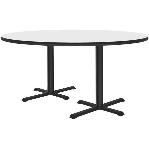 A white Correll round cafe table with two black cross bases.