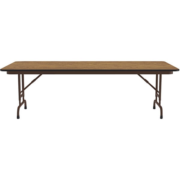 A Correll rectangular folding table with a oak top and brown metal legs.