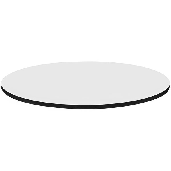 A white circular table top with black edges.