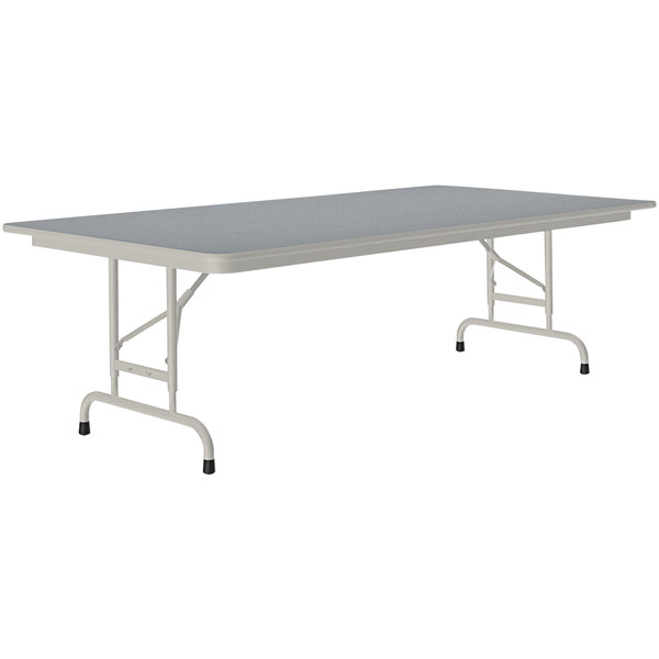 A rectangular table with a gray granite top and gray legs.