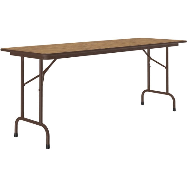 A brown rectangular Correll folding table with a metal frame.