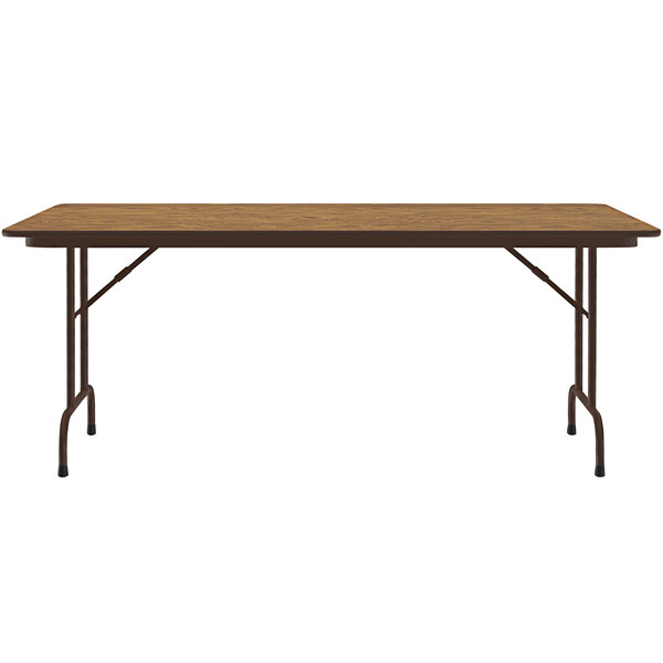 A Correll rectangular folding table with a medium oak wooden top and brown metal frame.