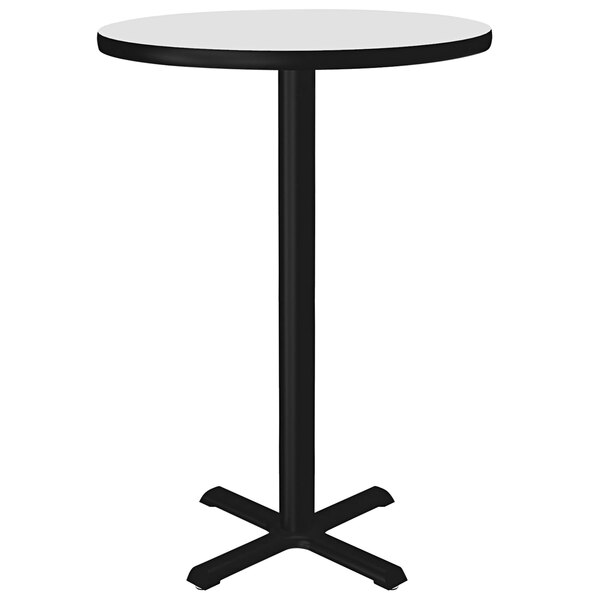 A Correll round bar height table with a white dry erase board top and black base.