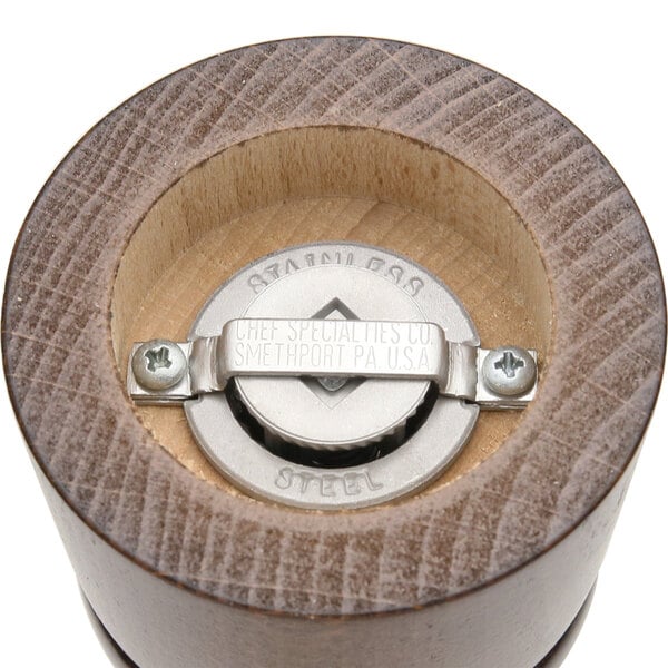 A close-up of a Chef Specialties Imperial Walnut pepper mill.