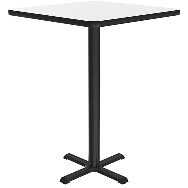 A white square Correll bar height table with a black base.