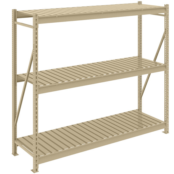 A tan metal Tennsco boltless shelving unit with corrugated decks.