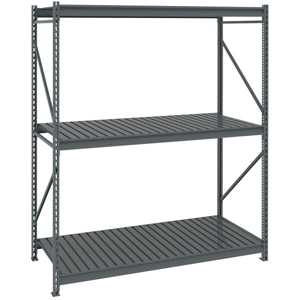 A Tennsco dark gray metal bulk storage rack unit with corrugated decking.