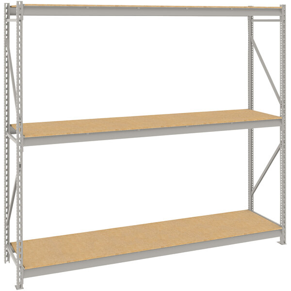 A Tennsco light gray metal bulk storage rack unit with particleboard shelves.