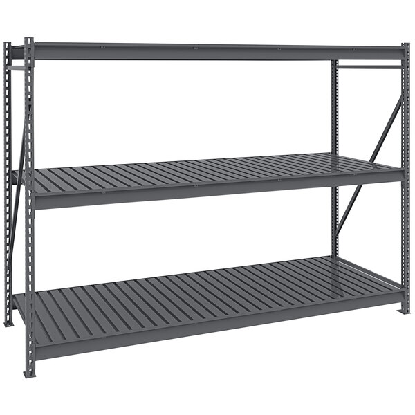 A dark grey Tennsco boltless shelving unit with corrugated decking.