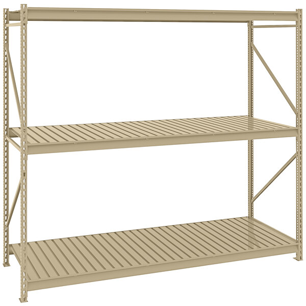 A tan metal Tennsco boltless shelving unit with corrugated decking.