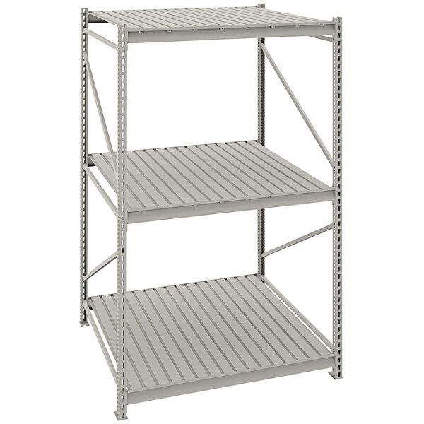 A light gray metal Tennsco bulk shelving unit with corrugated decking.