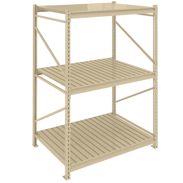 A Tennsco beige boltless shelving unit with corrugated decking on each shelf.