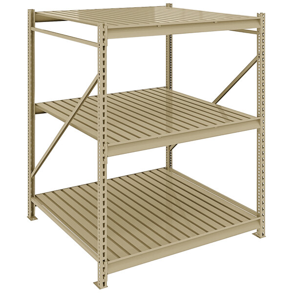 A tan metal Tennsco boltless shelving unit with three shelves.