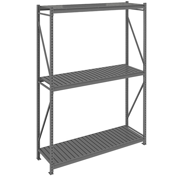 A dark gray metal Tennsco boltless shelving unit with corrugated decking.
