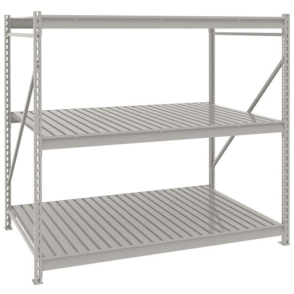 A light gray Tennsco metal bulk shelving unit with corrugated decking.