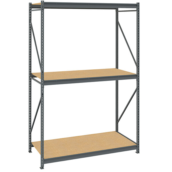 A Tennsco dark gray metal bulk storage rack unit with particleboard decking.