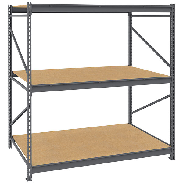 A Tennsco dark gray metal bulk storage rack unit with particleboard decking.