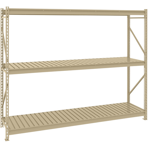 A tan metal Tennsco bulk storage rack unit with corrugated decking.