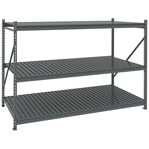 A dark gray metal Tennsco bulk shelving unit with corrugated decking.