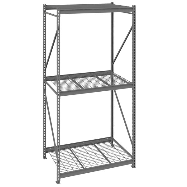 A dark gray metal Tennsco bulk storage rack unit with wire decking.