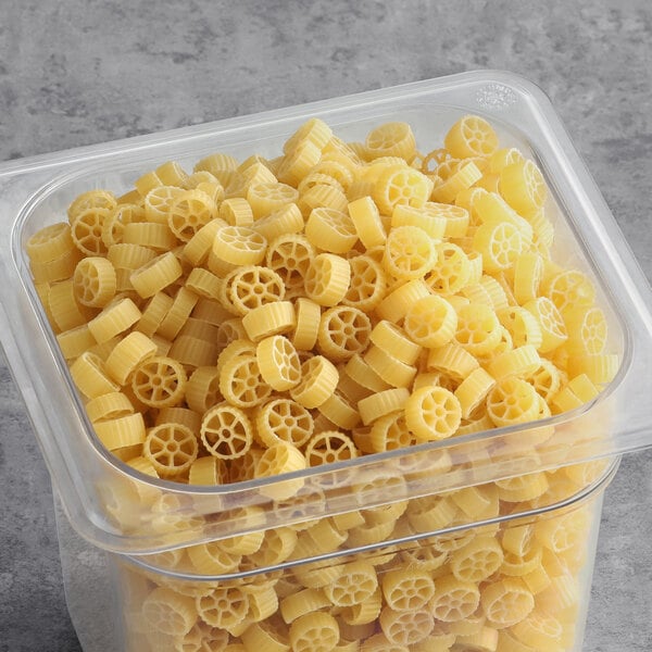 A plastic container of Barilla Mini Wheels Pasta.
