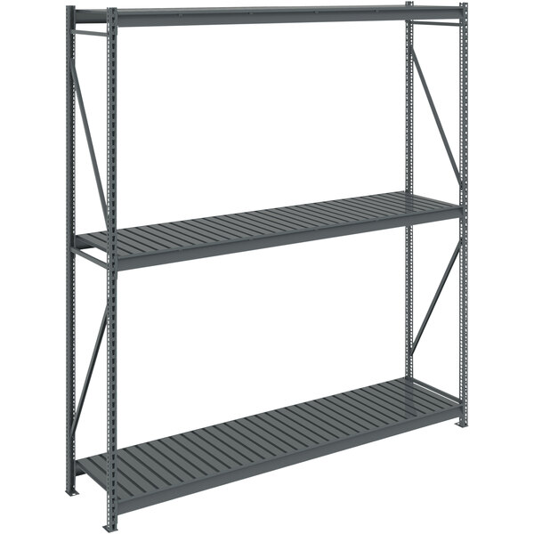 A dark gray metal Tennsco bulk storage rack unit with corrugated decking.