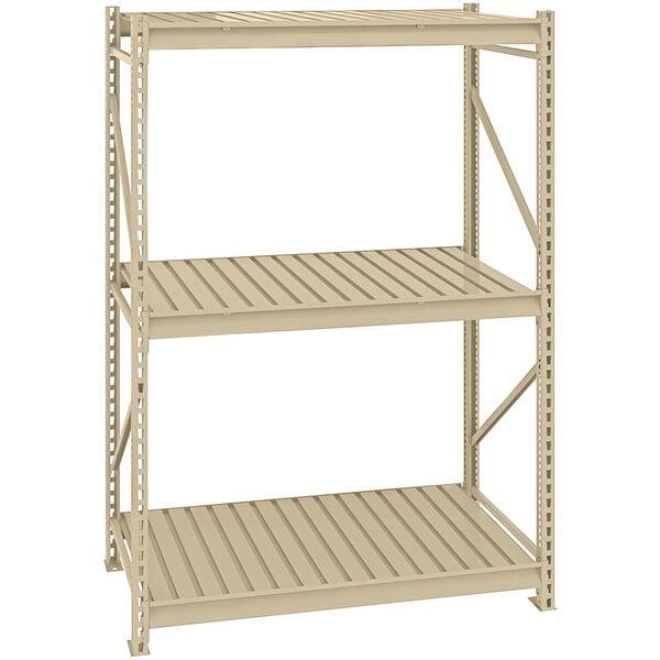 A tan metal Tennsco boltless shelving unit with corrugated decking.