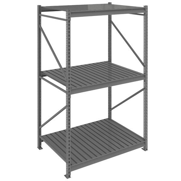 A dark gray metal Tennsco boltless shelving unit with corrugated decking.