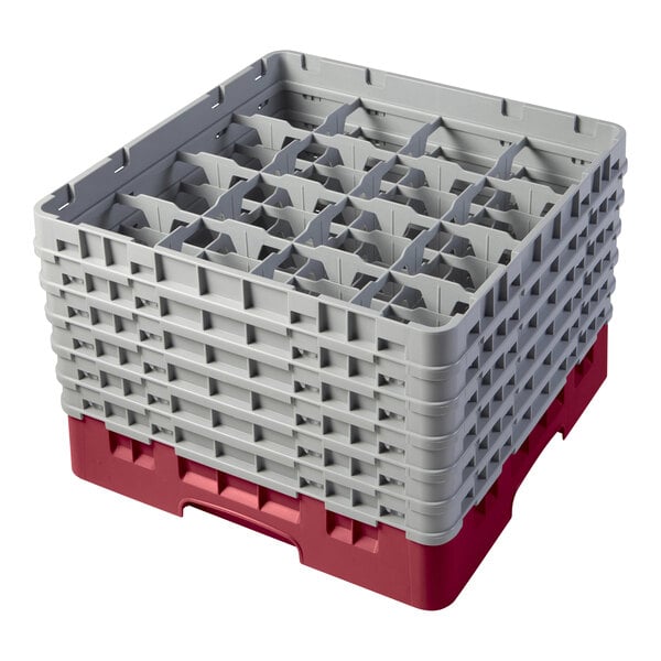 A red and gray plastic Cambro glass rack with several extenders stacked on top.