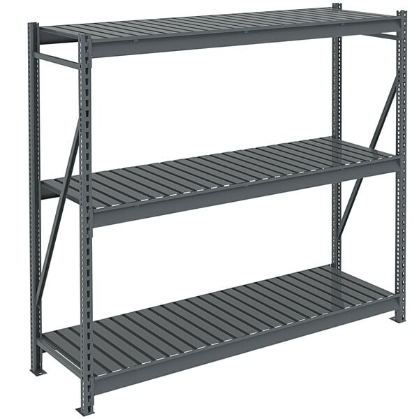 A dark gray metal Tennsco boltless shelving unit with corrugated decking.