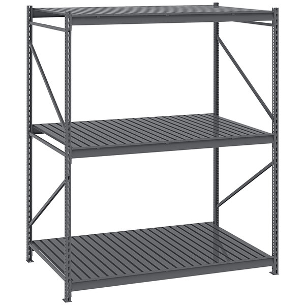 A dark gray metal Tennsco bulk storage rack unit with corrugated decking.