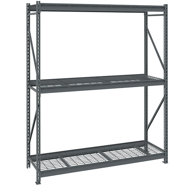 A dark grey Tennsco bulk storage rack with wire decking.