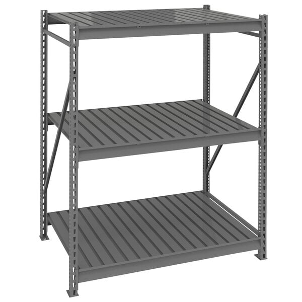 A dark gray metal Tennsco boltless shelving unit with corrugated shelves.
