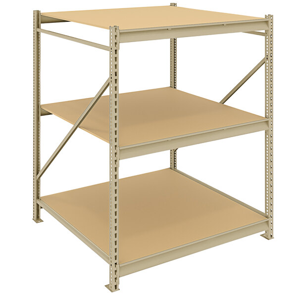 A tan metal Tennsco boltless shelving unit with three particleboard shelves.