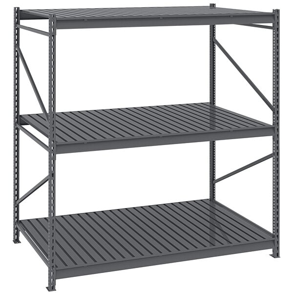 A Tennsco dark gray metal boltless shelving unit with corrugated steel decking.