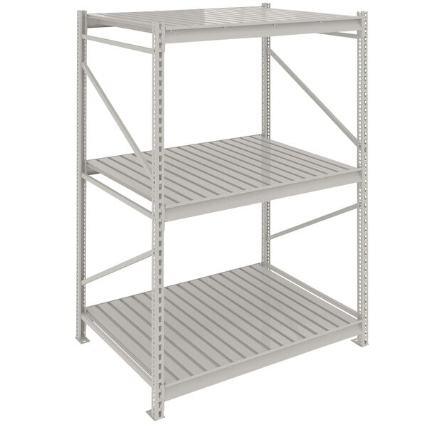 A light gray metal Tennsco boltless shelving unit with corrugated decking.