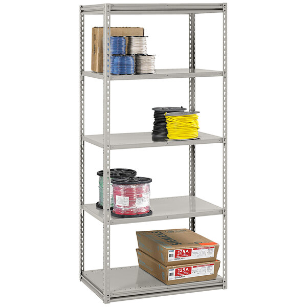 A light gray Tennsco solid steel shelving unit holding wire rolls.