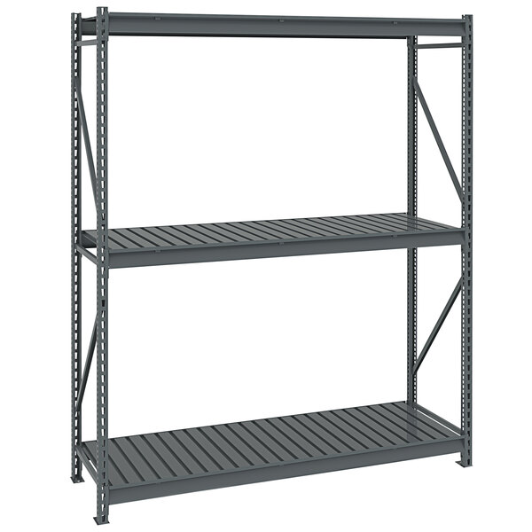 A dark gray metal Tennsco boltless shelving unit with corrugated decking.