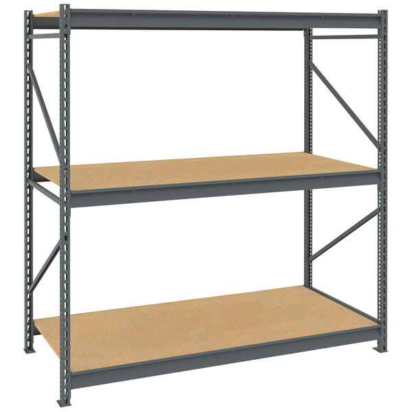 A Tennsco dark gray metal boltless shelving unit with particleboard decking.