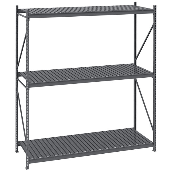 A Tennsco dark grey metal boltless shelving unit with corrugated decking on two shelves.