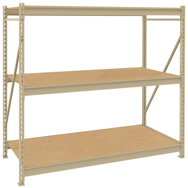 A Tennsco beige metal shelving unit with particleboard shelves.