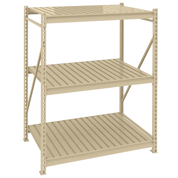 A tan metal Tennsco boltless shelving unit with corrugated decking.